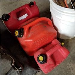 THREE RED GAS CANS