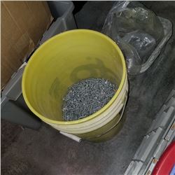 YELLOW AND WHITE BUCKET OF SCREWS