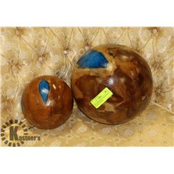 TWO LARGE WOOD TURNED BALLS WITH BLUE EPOXY.