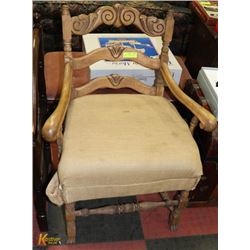 ANTIQUE CARVED WOOD ARM CHAIR.