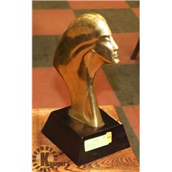 BRASS WOMANS FACE ON A WOODEN STAND