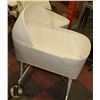 Image 1 : WICKER BASSINET (WHEELS FOLD UP FOR CARRYING)