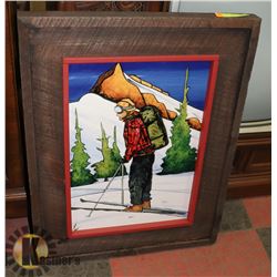 WOOD FRAMED PAINTING OF A SKIIER.