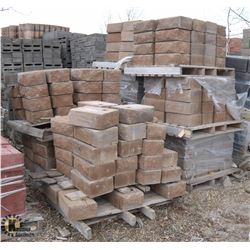 9 SKIDS OF ORANGE RETAINING WALL BLOCKS