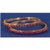 PAIR OF 14K GOLD BRACELETS SET WITH RUBIES