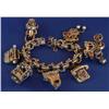 Image 1 : 14K GOLD CHARM BRACELET with 7 charms-some moving