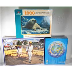 9)  LOT OF 3 FACTORY SEALED PUZZLES