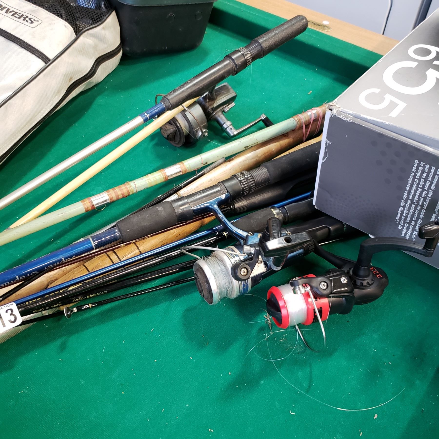 BUNDLE OF VINTAGE FISHING RODS W/ REELS AND ROLL UP FISHING TACKLE BOX
