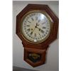 Image 1 : Antique chiming Sessions wall clock with visible decorative pendulum, Roman numeral and Arabic calen