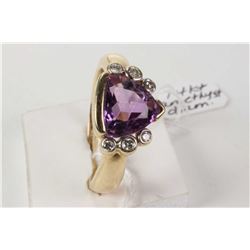 Ladies 14kt yellow gold ring set with trillion cut amethyst gemstone and six bezel set accent diamon
