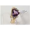 Image 1 : Ladies 14kt yellow gold ring set with trillion cut amethyst gemstone and six bezel set accent diamon