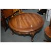 Image 2 : Semi contemporary round coffee table with Victorian style scroll feet and a button tufted open arm p
