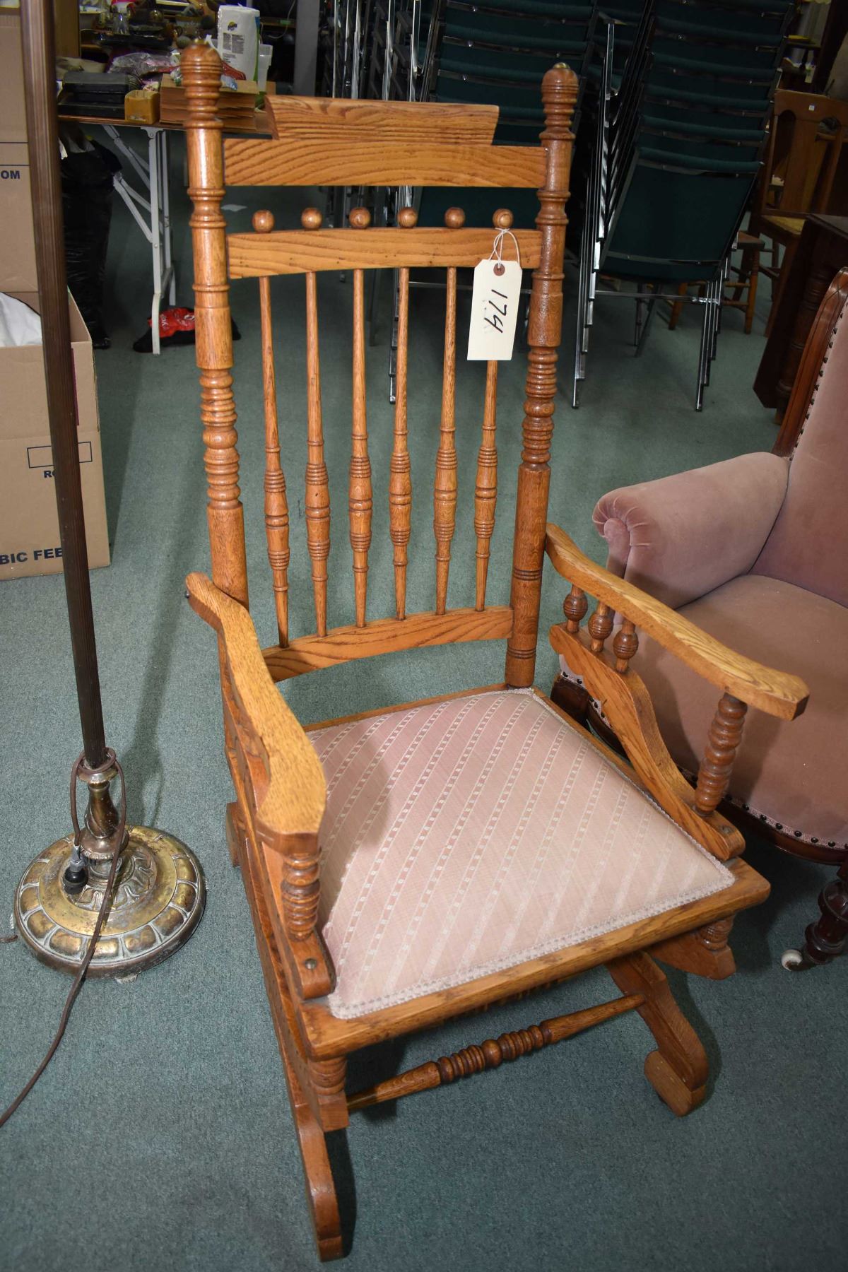 Antique oak spindle back open arm platform rocker