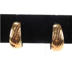 Four pairs of gold earrings including 14kt yellow gold hoops etc.