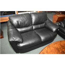 Two piece leather/bonded leather living room suite including full sized sofa and matching loveseat