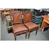 Image 1 : Pair of antique side chairs with carved backs, leather upholstered seat and back and porcelain casto