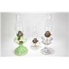 Image 1 : Three vintage oil lamps including green glass lam. colourless finger lamp etc.