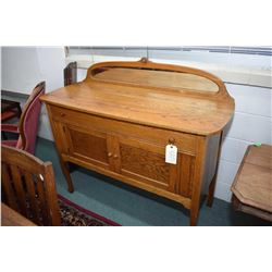 Mirrored back Canadiana oak sideboard with two doors and single drawer on tall supports