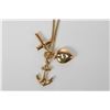Image 1 : 14kt yellow gold 18" box chain and a 10kt yellow gold "Faith, Hope and Charity" pendant/charm