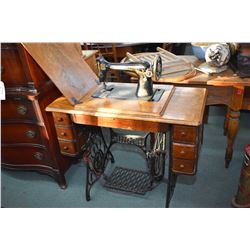 Primitive single drawer baker's table and a oak cased Singer treadle sewing machine