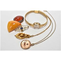 Selection of vintage jewellery including carnelian brooch, amber brooch, Caravelle vintage watch, an