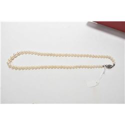 Single strand of Japanese Akoya pearls 18" in length with German .835 silver clasp. Retail replaceme