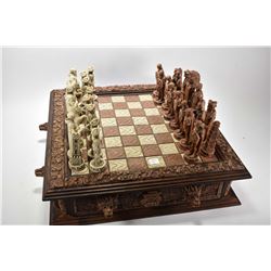 Large resin chess board with two drawers representing the Spanish Conquest of the Aztec empire with 