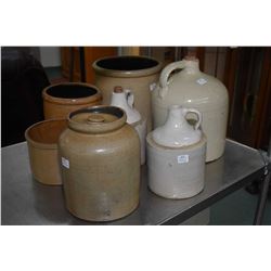 Seven pieces of vintage stoneware including three jugs and four crocks