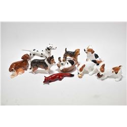 Tray lot of collectible dog figurines including eight Royal Doulton, Beswick flambe fox and a Midwin