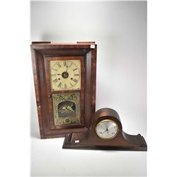 Two antique clocks including a Westbury top hat mantle clock and a weight driven wall clock. both ne