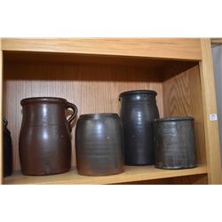 Shelf lot of seven brown glazed stoneware pieces including four jugs and three crocks. Not available