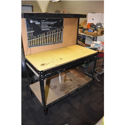 Work bench and single drawer loaded with small tools