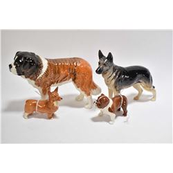 Selection of Beswick dog figures including St. Bernard, Alsatian, bull dog and a Corgi