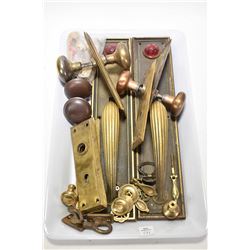 Selection of vintage and antique brass door knobs and escutcheons