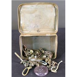 Tin box of early brass hardware