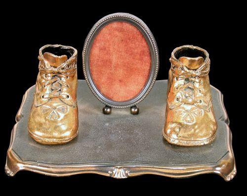 Bronzed baby shoes with photo frame