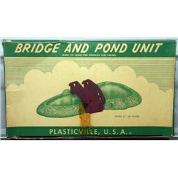 PLASTICVILLE BRIDGE AND POND.