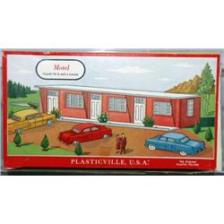PLASTICVILLE MOTEL. SALMON WALLS, WHITE ROOF AND 