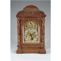 CARVED OAK MANTLE CLOCK