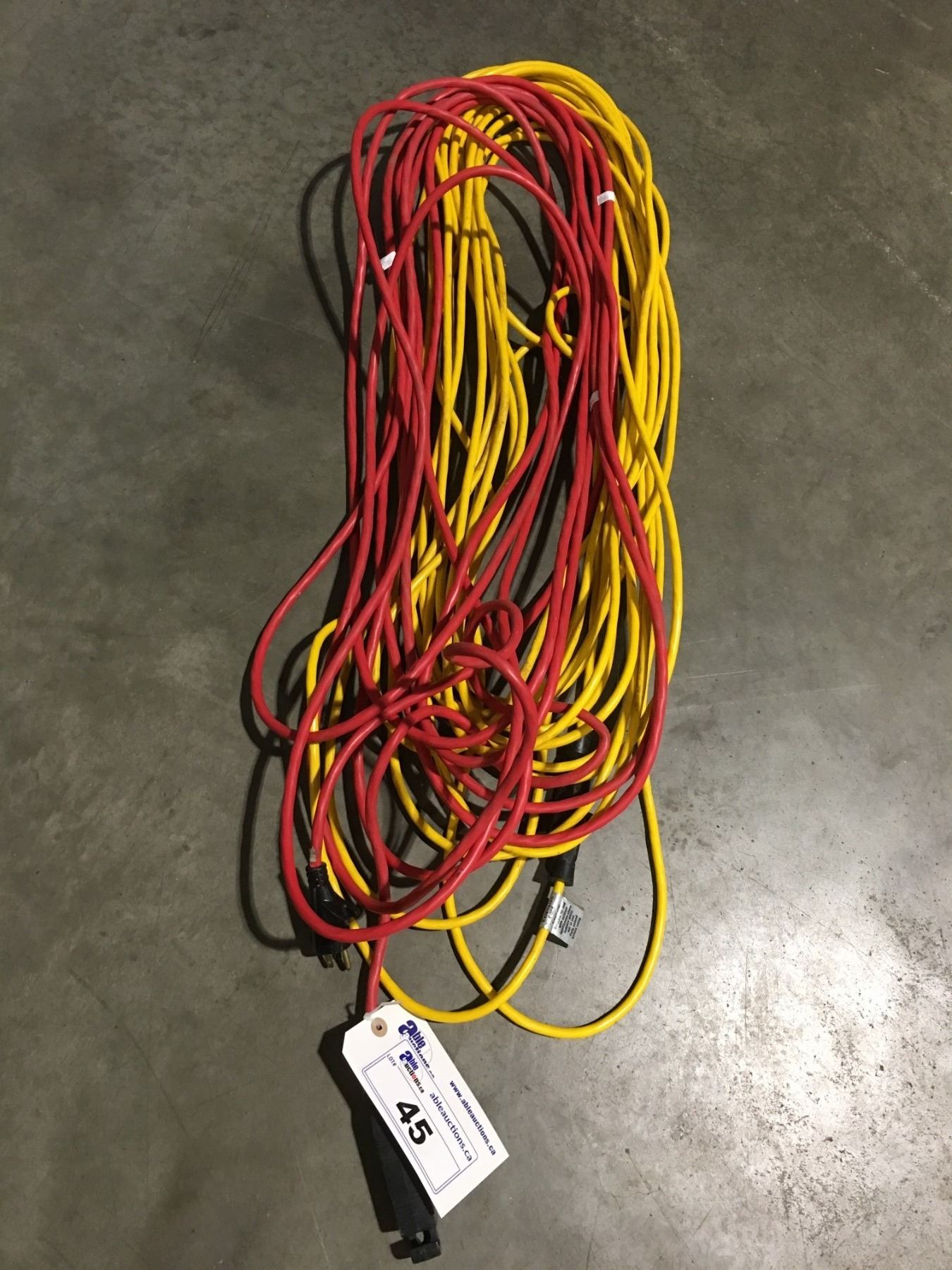 2 EXTENSION CORDS RED & YELLOW