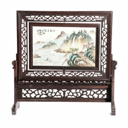 Framed Chinese landscape painted on porcelain.