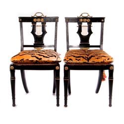 Four Ebonized side chairs.