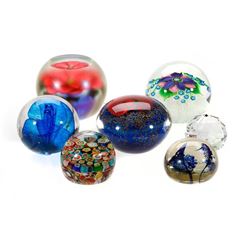 Seven Art Glass paperweights.