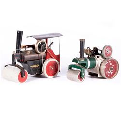 Two vintage steam roller toys.