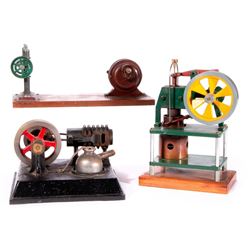 Three model factory machines.