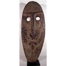 AN OLD SAWOS GABLE MASK,of wood in ovoid form wit