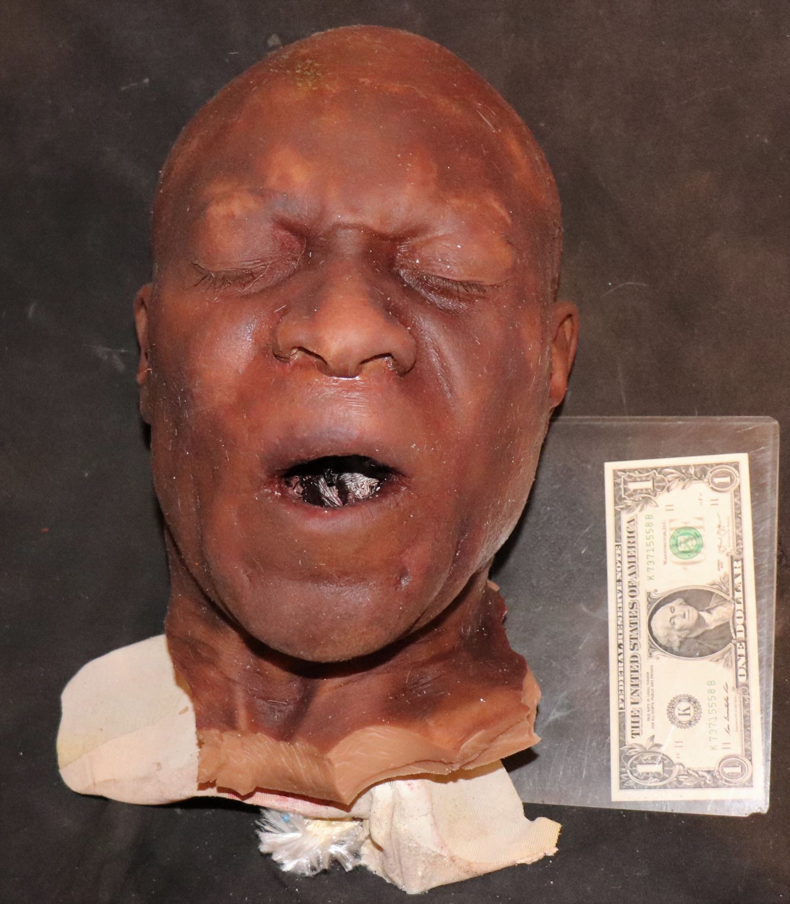 SEVERED SILICONE BLACK MAN HEAD WITH MOUTH OPEN MICHAEL CLARK DUNCAN?