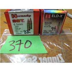 lot 6.5 mm and 6 mm bullets counts on box
