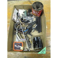 box of assorted gun parts
