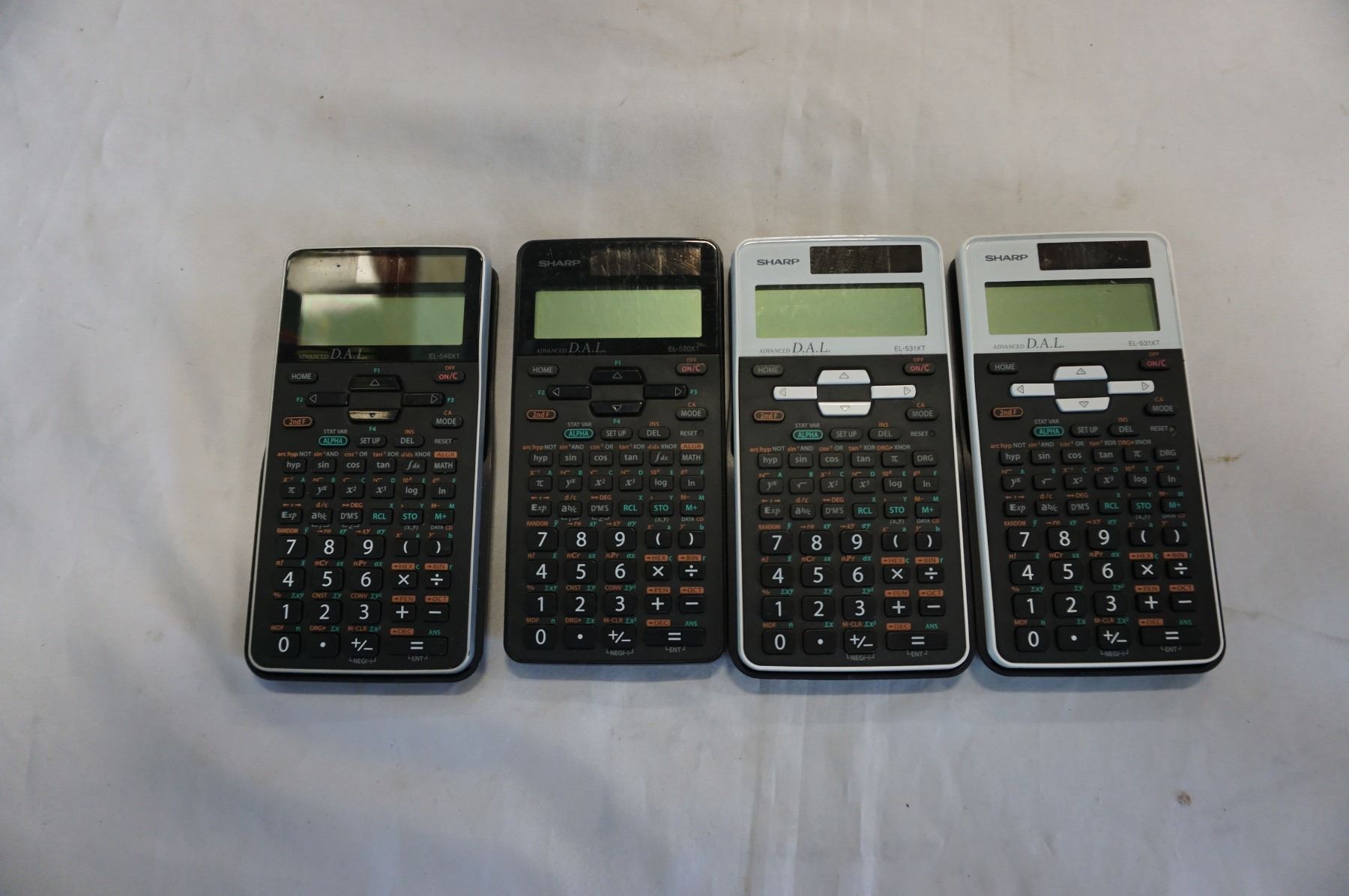 4 SHARP ADVANCE D.A.L CALCULATORS